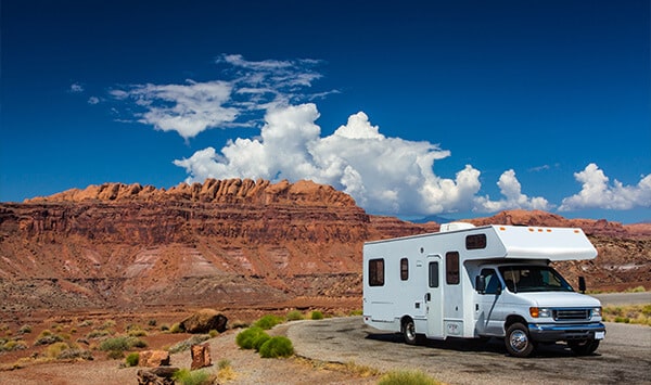 RV parked along a picturesque scene in the desert